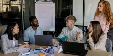 Marketing team discussing which digital marketing metrics and kpis to follow.