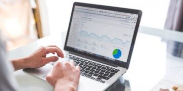 Website manager checking SEO results after optimizing a small business website.